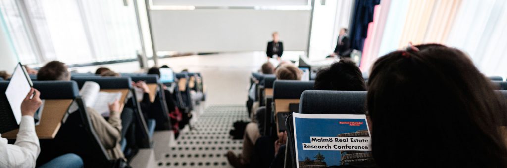 People attending a research conference